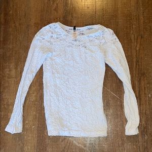 A tight long sleeve white shirt.